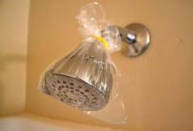 How do I descale a shower head without taking it apart?